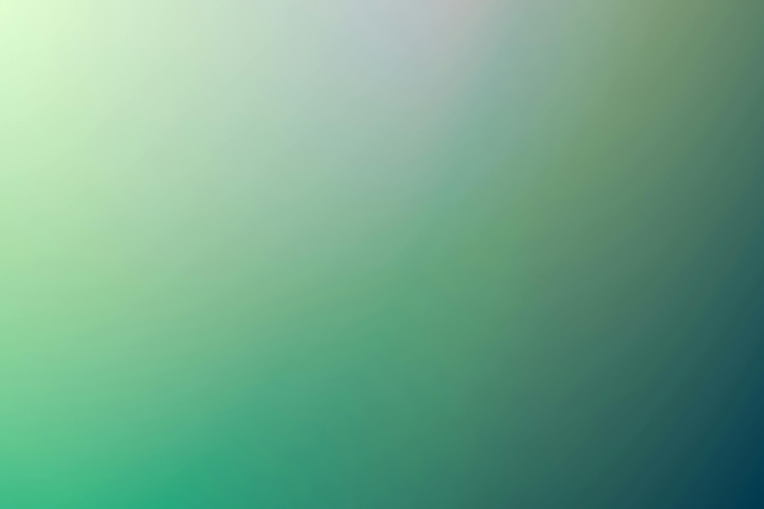 A smooth green gradient background ideal for digital design projects and wallpapers.
